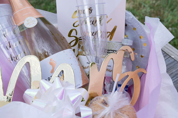 Basket filled with champagne and other gifts