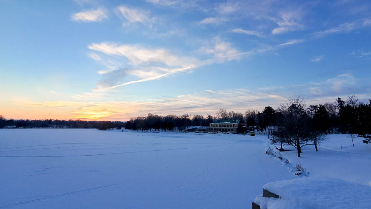 Hoyt Lake in Delaware Park covered in snow at sunrise
